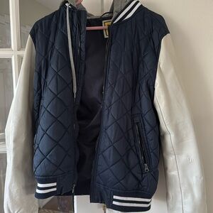 Varsity jacket with navy quilting, white faux leather sleeves and grey hoodie